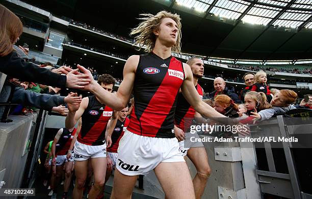 Dyson Heppell of the Bombers comes onto the field after half time during the 2015 AFL round 23 match between the Collingwood Magpies and the Essendon...