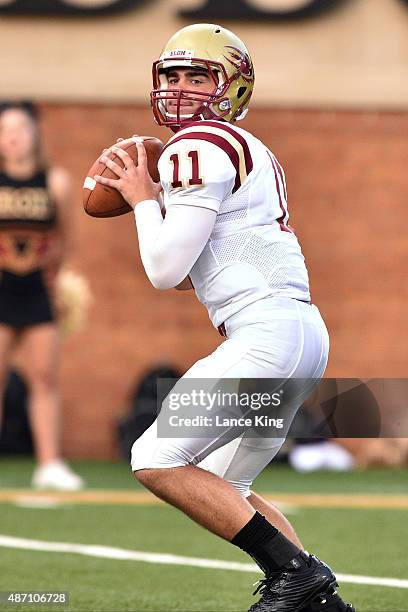 Daniel Thompson of the Elon Phoenix drops back to pass against the Wake Forest Demon Deacons at BB&T Field on September 3, 2015 in Winston-Salem,...