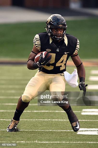 Tyler Bell of the Wake Forest Demon Deacons runs with the ball against the Elon Phoenix at BB&T Field on September 3, 2015 in Winston-Salem, North...