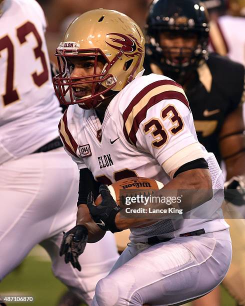 Bennett of the Elon Phoenix runs with the ball against the Wake Forest Demon Deacons at BB&T Field on September 3, 2015 in Winston-Salem, North...