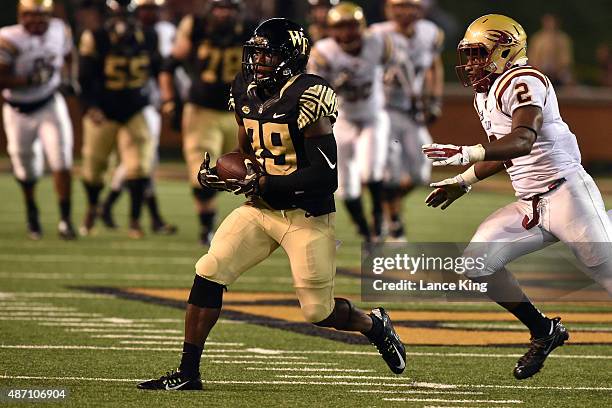 Chuck Wade of the Wake Forest Demon Deacons catches a pass against the Elon Phoenix at BB&T Field on September 3, 2015 in Winston-Salem, North...