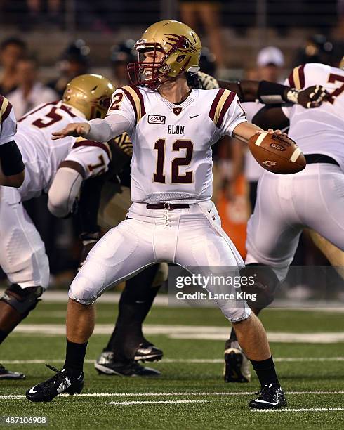 Connor Christiansen of the Elon Phoenix drops back to pass against the Wake Forest Demon Deacons at BB&T Field on September 3, 2015 in Winston-Salem,...