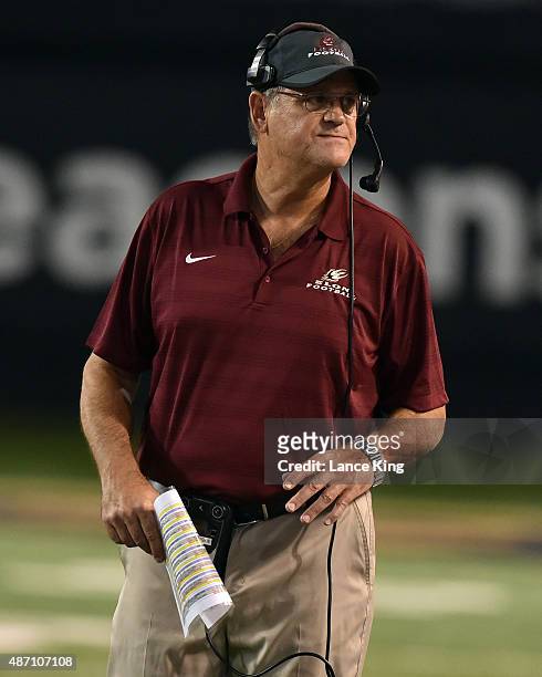 Defensive Coordinator Jerry Petercuskie of the Elon Phoenix looks on during their game against the Wake Forest Demon Deacons at BB&T Field on...