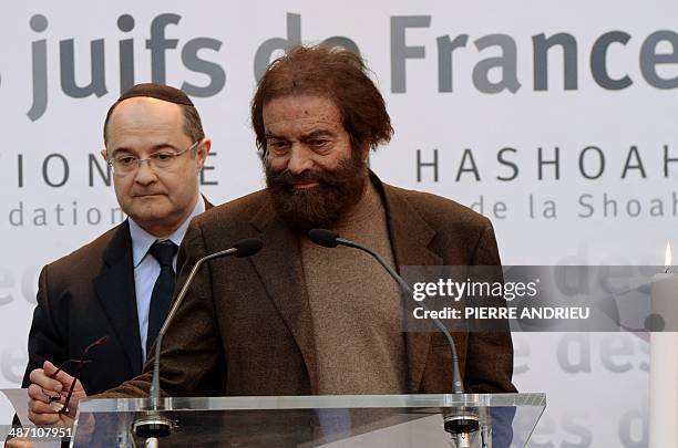 French Jewish writer Marek Halter reads from a list of names of Jews deported during World War II, alongside Ariel Goldmann , the president of the...