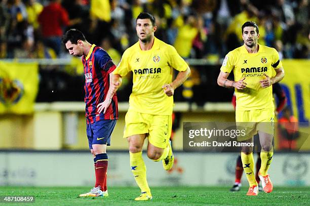 Lionel Messi of FC Barcelona looks dejected after Cani of Villarreal CF scored the opening goal during the La Liga match between Villarreal CF and FC...