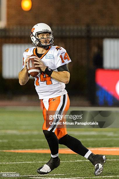 Travis Lulay of the BC Lions looks to play the ball during the CFL game against the Montreal Alouettes at Percival Molson Stadium on September 3,...