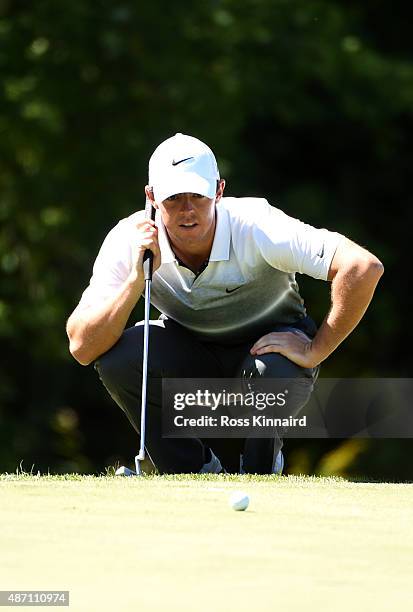 Rory McIlroy of Northern Ireland lines up his putt on the 18th green during round three of the Deutsche Bank Championship at TPC Boston on September...