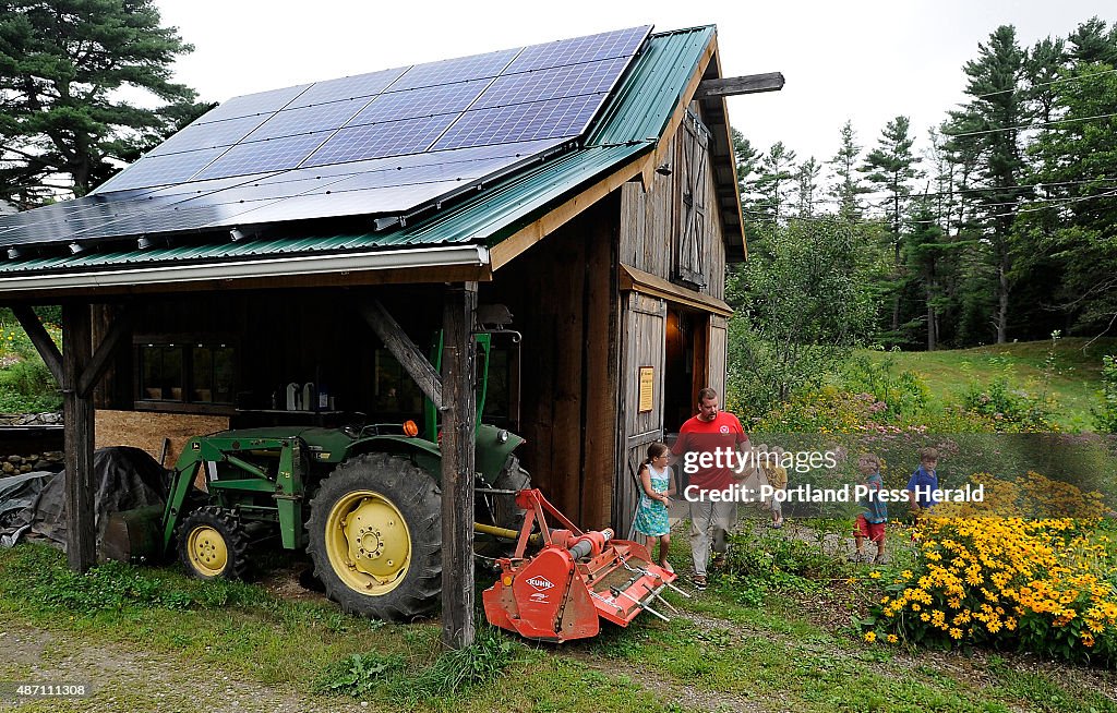 Solar panels cover the roof of the farm stand at Little Ridge Farm...