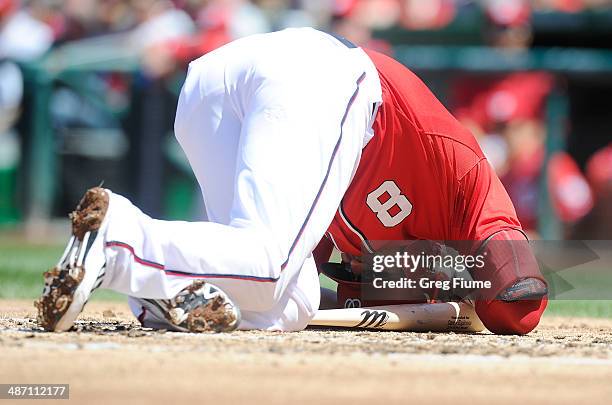 Danny Espinosa of the Washington Nationals on the ground after being hit by a pitch in the second inning against the San Diego Padres at Nationals...