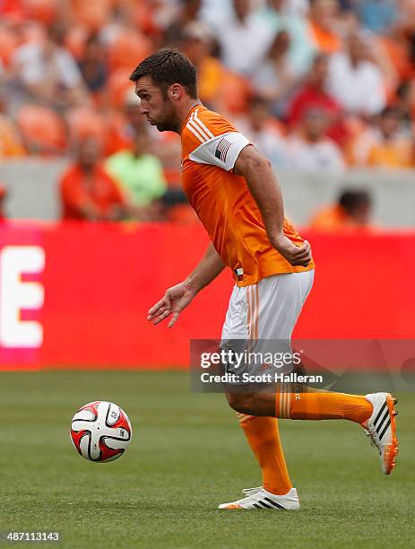 Will Bruin of the Houston Dynamo works the ball against the Portland Timbers during the second half of their game at BBVA Compass Stadium on April...