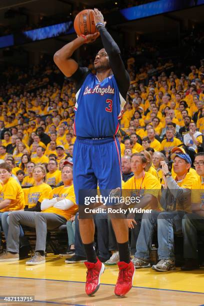 Chris Paul of the Los Angeles Clippers takes a shot against the Golden State Warriors in Game Four of the Western Conference Quarterfinals during the...