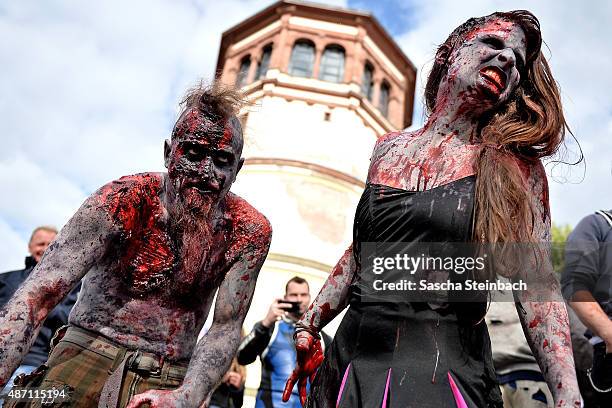 Participants take part at the Zombie Walk Duesseldorf along the Rheinuferpromenade on September 6, 2015 in Duesseldorf, Germany. A zombie walk is an...