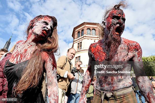 Participants take part at the Zombie Walk Duesseldorf along the Rheinuferpromenade on September 6, 2015 in Duesseldorf, Germany. A zombie walk is an...