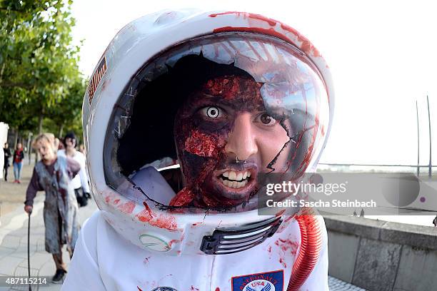 Participants take part at the Zombie Walk Duesseldorf along the Rheinuferpromenade on September 6, 2015 in Duesseldorf, Germany. A zombie walk is an...