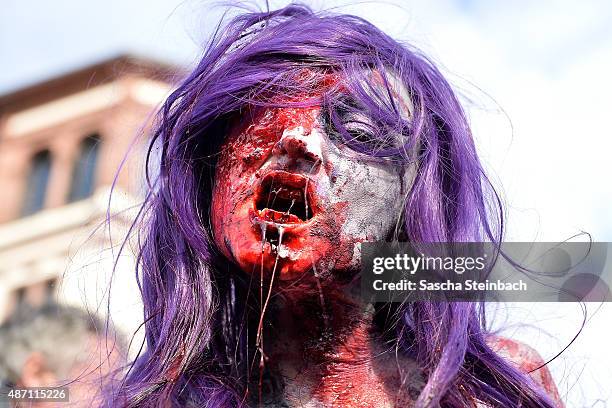 Participants take part at the Zombie Walk Duesseldorf along the Rheinuferpromenade on September 6, 2015 in Duesseldorf, Germany. A zombie walk is an...