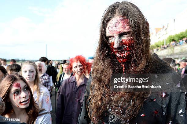 Participants take part at the Zombie Walk Duesseldorf along the Rheinuferpromenade on September 6, 2015 in Duesseldorf, Germany. A zombie walk is an...