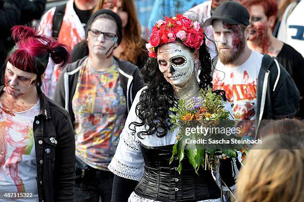 Participants take part at the Zombie Walk Duesseldorf along the Rheinuferpromenade on September 6, 2015 in Duesseldorf, Germany. A zombie walk is an...