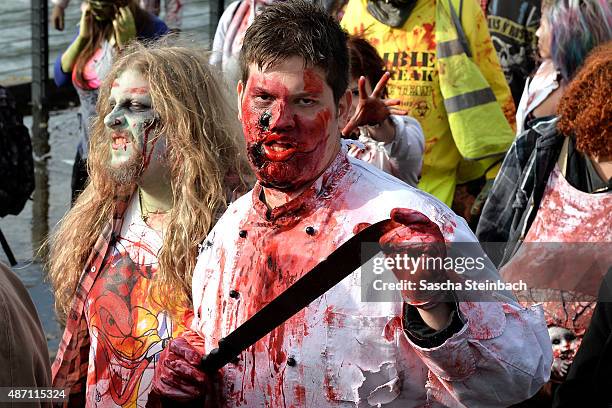 Participants take part at the Zombie Walk Duesseldorf along the Rheinuferpromenade on September 6, 2015 in Duesseldorf, Germany. A zombie walk is an...