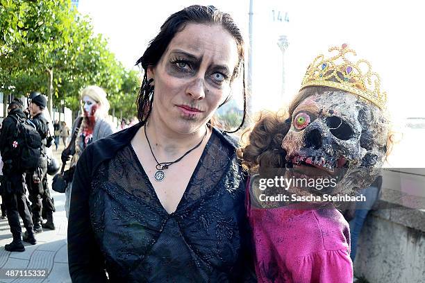 Participants take part at the Zombie Walk Duesseldorf along the Rheinuferpromenade on September 6, 2015 in Duesseldorf, Germany. A zombie walk is an...