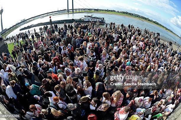 Participants take part at the Zombie Walk Duesseldorf along the Rheinuferpromenade on September 6, 2015 in Duesseldorf, Germany. A zombie walk is an...