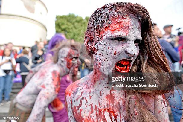 Participants take part at the Zombie Walk Duesseldorf along the Rheinuferpromenade on September 6, 2015 in Duesseldorf, Germany. A zombie walk is an...