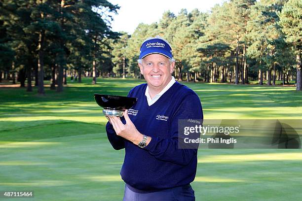 Colin Montgomerie of Scotland poses with the trophy after the final round of the Travis Perkins Masters played at the Duke's Course, Woburn Golf Club...