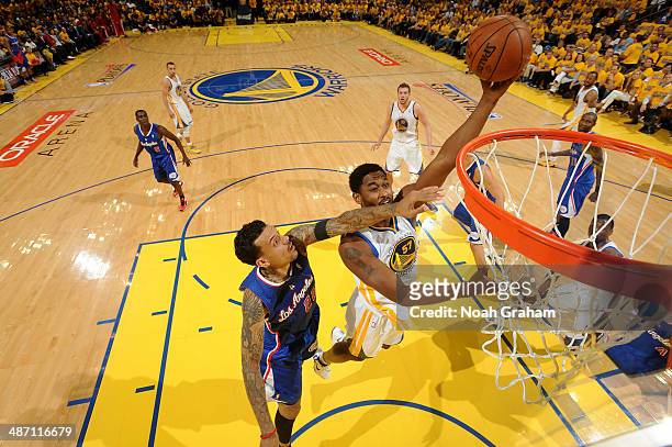 Hilton Armstrong of the Golden State Warriors puts up the shot against Matt Barnes of the Los Angeles Clippers in Game Four of the Western Conference...
