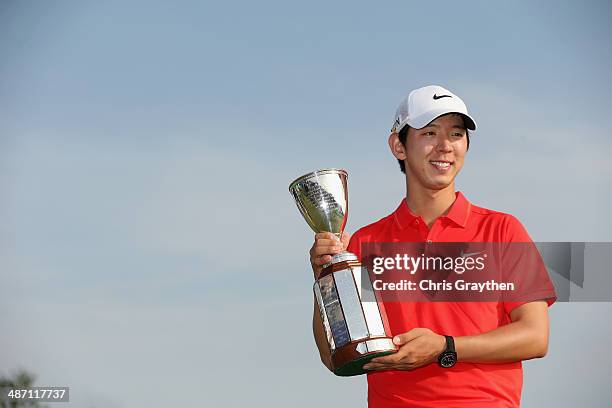 Seung-Yul Noh celebrates after his win with the Zurich trophy during the Final Round of the Zurich Classic of New Orleans at TPC Louisiana on April...