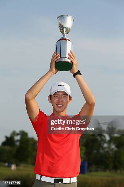 Seung-Yul Noh celebrates after his win with the Zurich trophy during the Final Round of the Zurich Classic of New Orleans at TPC Louisiana on April...