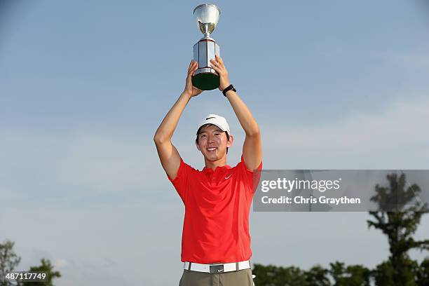 Seung-Yul Noh celebrates after his win with the Zurich trophy during the Final Round of the Zurich Classic of New Orleans at TPC Louisiana on April...