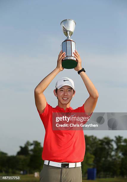 Seung-Yul Noh celebrates after his win with the Zurich trophy during the Final Round of the Zurich Classic of New Orleans at TPC Louisiana on April...