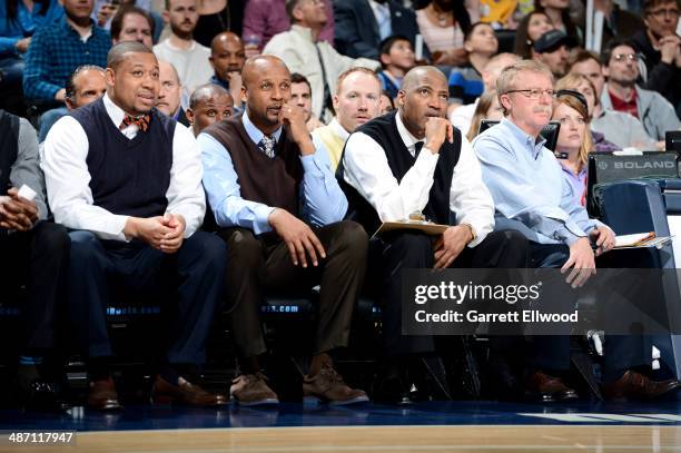 Head Coach Brian Shaw, assistant coaches Melvin Hunt and Lester Conneron, and athetic trainer Jim Gillen of the Denver Nuggets sit on the sideline...