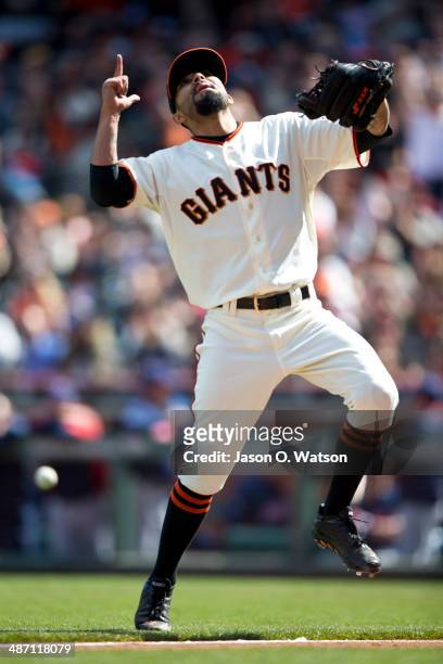 Sergio Romo of the San Francisco Giants celebrates after striking out Carlos Santana of the Cleveland Indians during the ninth inning at AT&T Park on...