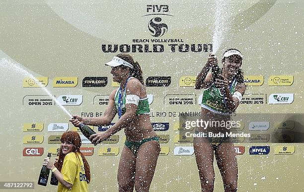 Larissa Franca and Talita Antunes of Brazil celebrate after winning Rio Open women's beach volleyball final match against compatriots Agatha...