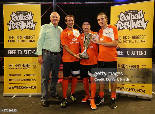 Soccerex President Tony Martin present the Scorpions with the winning trpphy during the Soccerex - Manchester football festival at Granada Studios on...