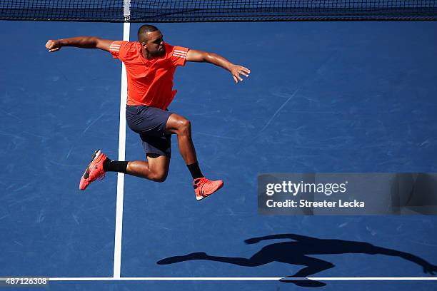 Jo-Wilfried Tsonga of France celebrates after defeating Benoit Paire of France during their Men's Singles Fourth Round match on Day Seven of the 2015...