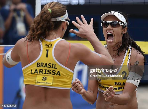 Talita Antunes and Larissa Franca of Brazil celebrate after winning their Rio Open women's beach volleyball final match against compatriots Agatha...