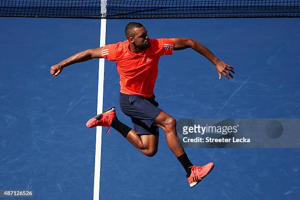 Jo-Wilfried Tsonga of France celebrates after defeating Benoit Paire of France during their Men's Singles Fourth Round match on Day Seven of the 2015...