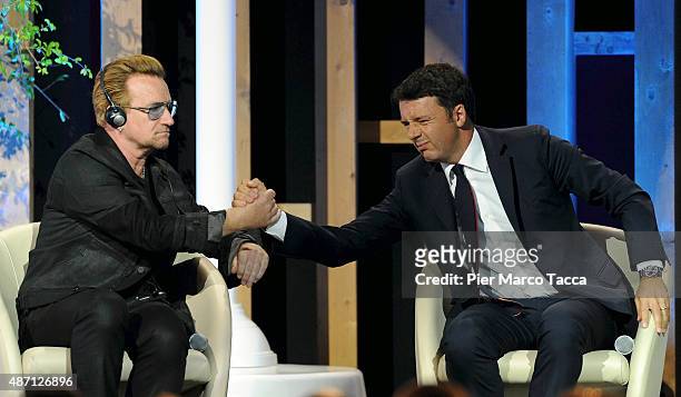Bono Vox Shaking hands to I talian Prime Minister Matteo Renzi duringattends the event 'It begins with me. How the world can end hunger in our...