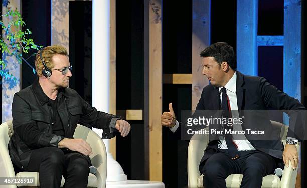 Bono Vox Shaking hands to I talian Prime Minister Matteo Renzi duringattends the event 'It begins with me. How the world can end hunger in our...