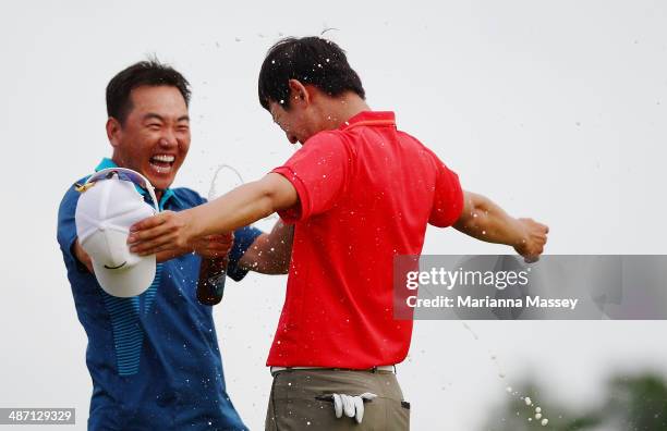 Seung-Yul Noh has beer poured on him by golfer Charlie Wi after winning the Zurich classic during the final round of the Zurich Classic of New...