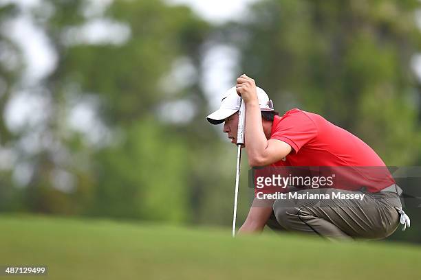 Seung-Yul Noh lines up his putt on the 18th green during the final round of the Zurich Classic of New Orleans at TPC Louisiana on April 27, 2014 in...