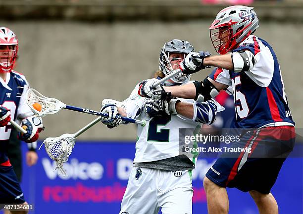 Brendan Mundorf of the Chesapeake Bayhawks goes to the goal as Mitch Belisle of the Boston Cannons defends during a game at Harvard Stadium on April...