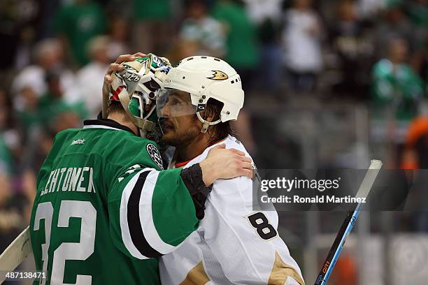 Kari Lehtonen of the Dallas Stars hugs Teemu Selanne of the Anaheim Ducks after a overtime game during Game Six of the First Round of the 2014 NHL...