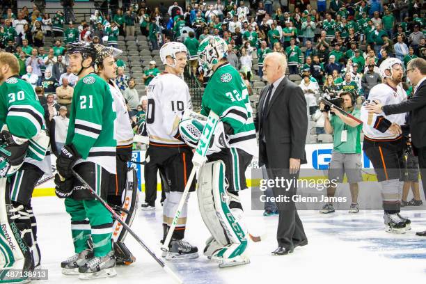 Corey Perry of the Anaheim Ducks shakes hands with Kari Lehtonen of the Dallas Stars after a Ducks victory in Game Six of the First Round of the 2014...