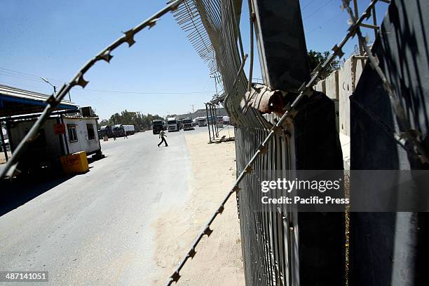 Trucks loaded with food supplies cross into the Palestinian city of Rafah through the Kerem Shalom crossing between Israel and the southern Gaza...