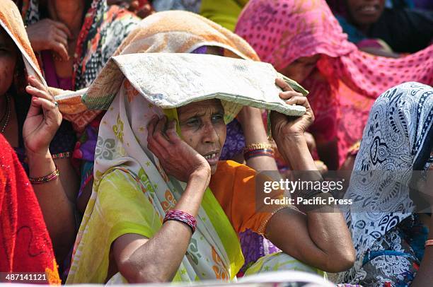 Bahujan Samaj Party supporters cover themselves for being safe from heat during BSP supremo Mayawati Election campaign Public Rally in Allahabad....
