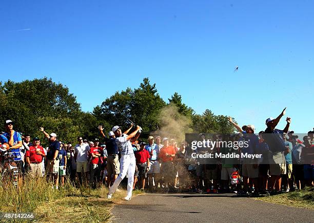 Rickie Fowler hits from the rough on the ninth hole during round three of the Deutsche Bank Championship at TPC Boston on September 6, 2015 in...