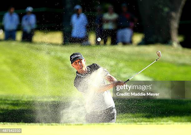 Matt Jones of Australia hits out of the bunker on the seventh hole during round three of the Deutsche Bank Championship at TPC Boston on September 6,...