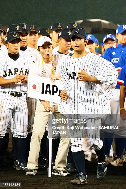 Pitcher Shotaro Ueno looks on of Japan pose for a photograph in the Gold Medal game between Japan and USA during the 2015 WBSC U-18 Baseball World...